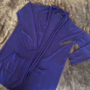 Long open front cardigan.